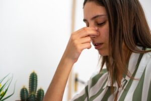 Woman with nose pain